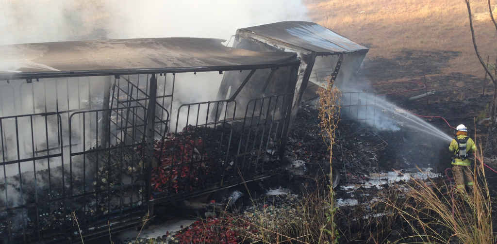 HORRIFIC: A truck, including both trailers owned by Pierce Transport carrying cooking oil, was burnt after the driver lost control yesterday morning. HORRIFIC: A truck, including both trailers owned by Pierce Transport carrying cooking oil, was burnt after the driver lost control yesterday morning.